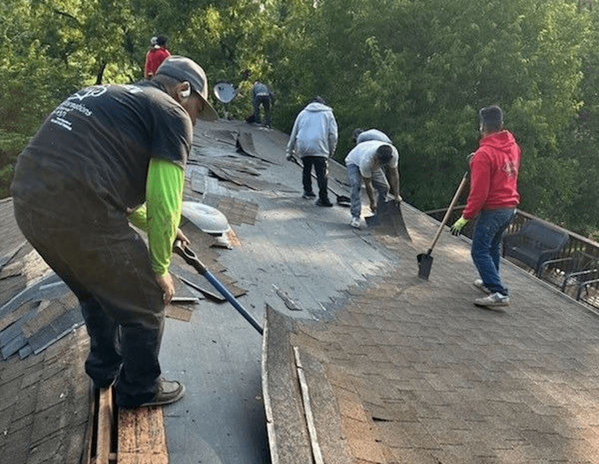 Crew engaged in roof maintenance work